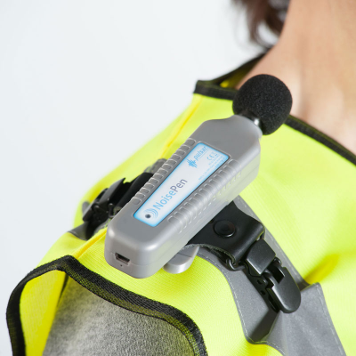 Pulsar Instruments personal noise dosimeter mounted on a worker&#39;s shoulder.