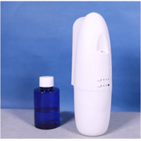 Diffuser aroma aroma dengan botol wewangian yang bisa diganti.